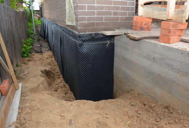 Happy homeowners after waterproofing job in Marietta